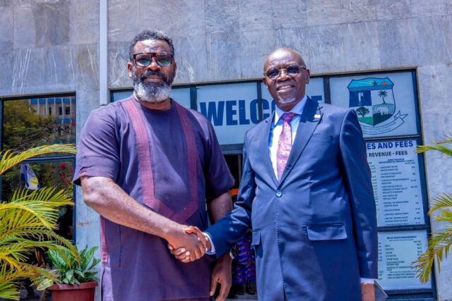 Monrovia City Mayor John-Charuk Saah Siafa in handshake with Mr. Mustapha TAF Njie, CEO of TAF Africa Global