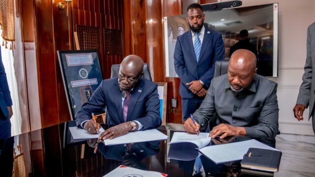 TAF Africa Global CEO, Mr. Mustapha TAF Njie and Mr. Jeff Blibo signing the Non-disclosure Agreement between TAF and the Government of Liberia, at the Executive Mansion in Monrovia