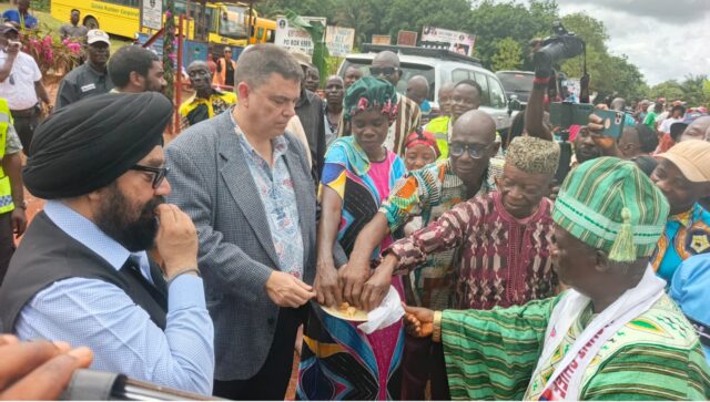 U.S. Charge d'Affaires Joseph Zadrozny being welcomed by traditional leaders of Margibi County's district #5 during his visit to the SRC_Jeety Rubbers