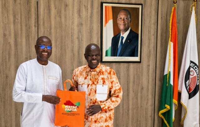 WATAF Executive Secretary Jules Tapsoba (L), presenting WATAF souvenirs and branded accessories to Ambassador Traore Kalilou after Tursday, May 26,2026 Meeting at the Ivorian Embassy in Abuja, Nigeria