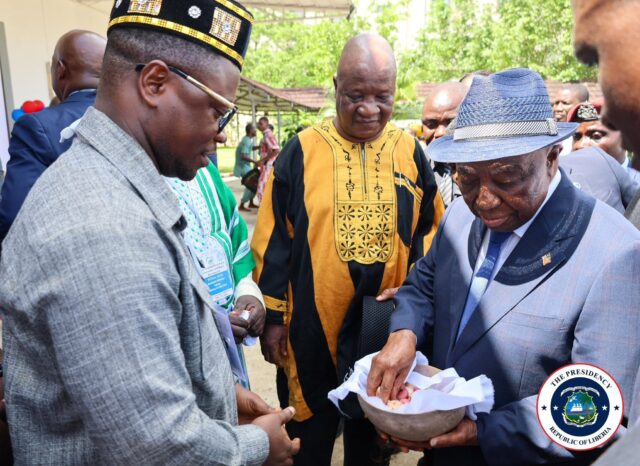 President Boakai being traditionally welcomed by the Superintendent of Margibi County where Farmington Hotel is situated