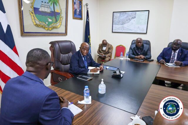 President Boakai listens attentively and takes notes of what the MCC National Coordinator Alieu Nyei was saying