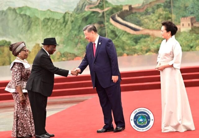 President being greeted by President Xi Jinping of China as both wives look on