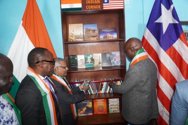 Ambassador Verma and the head of CNDRA cut the ribbon to India corner